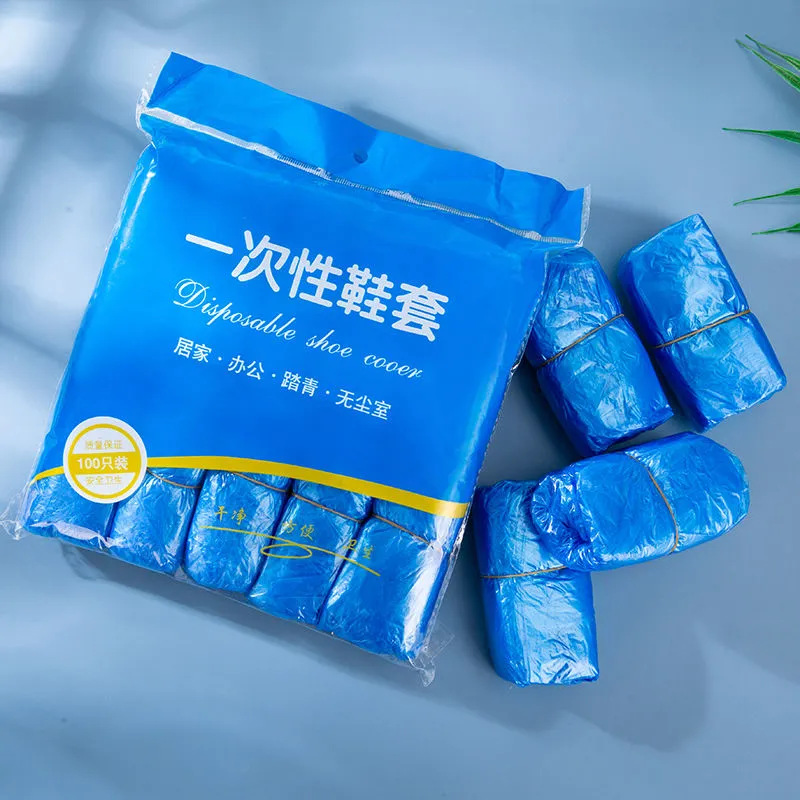 12462538.一次性鞋套防水塑料无纺布防滑脚套室内PE加厚鞋套防雨