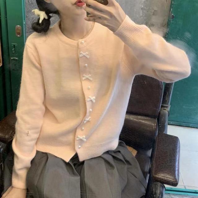 12888797.春秋蝴蝶结纽扣毛衣女款感韩系温柔风淡黄色针织外套圆领