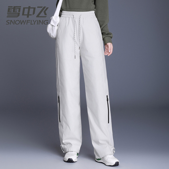 13138832.雪中飞男女同款羽绒裤宽松舒适防寒保暖时尚情侣户外舒适加厚裤子