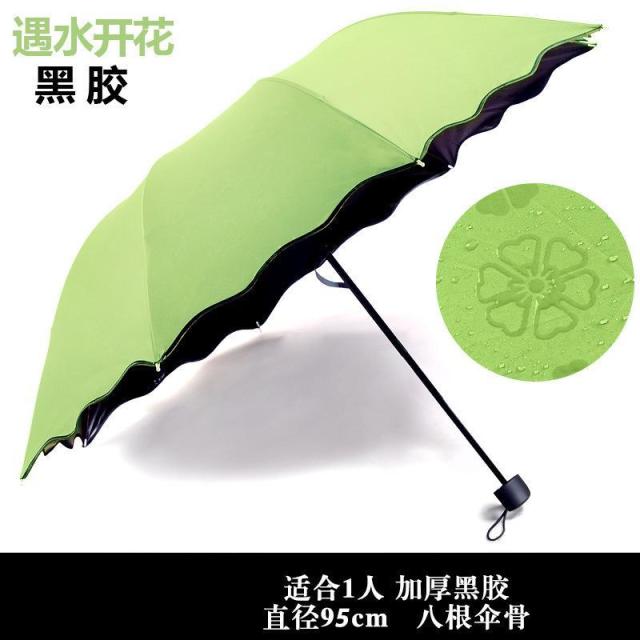 13081739.黑胶雨伞制遇水开花晴雨伞黑胶防晒三折太阳伞