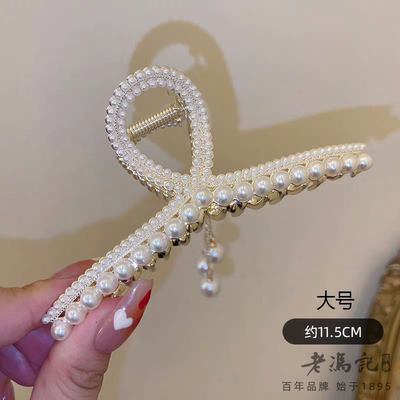 13787375.(爆款推荐)铃兰花流苏盘发发饰后脑勺古风发花朵鲨鱼夹
