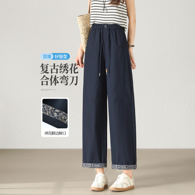 13392240.【左街右巷】复古绣花侧分割九分弯刀休闲裤