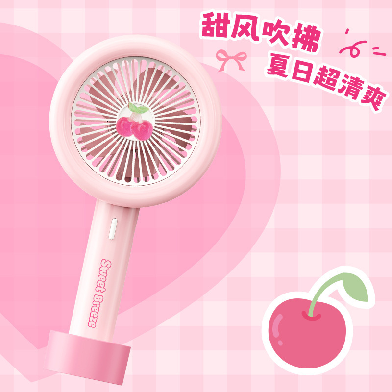 13506387.新款卡通手持小风扇USB充电便携夏日樱桃办公大风力电扇