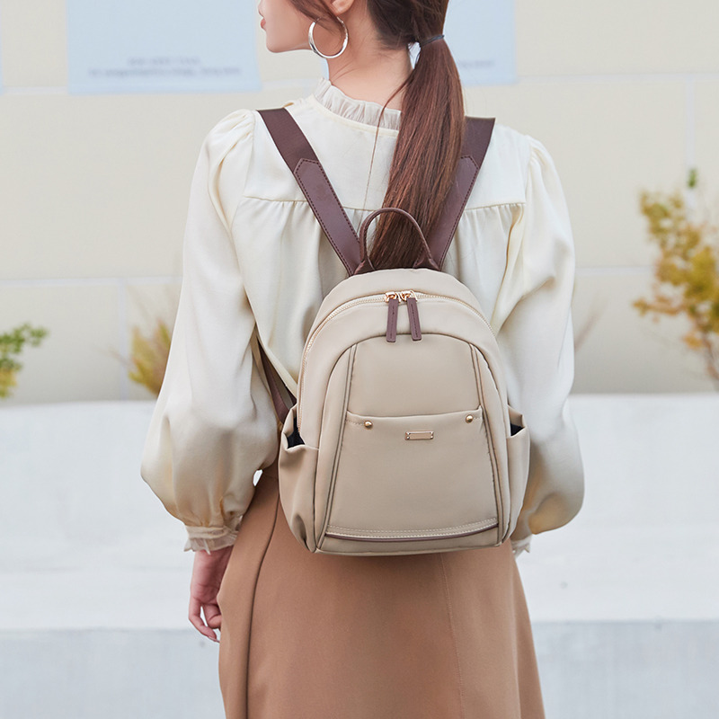 12682192.《广州质造》佐木新款简约休闲背包双肩女大容量通勤书包百搭双肩包女包
