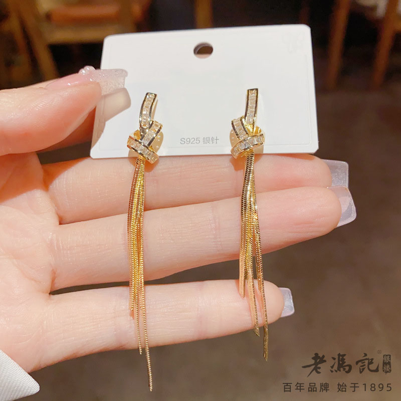 10620805.气质简约精致超闪锆石打结长款流苏S925银针