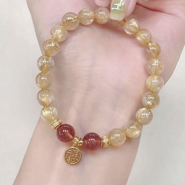 12629525.晶芭莎 福牌巴西天然金发晶草莓晶手链