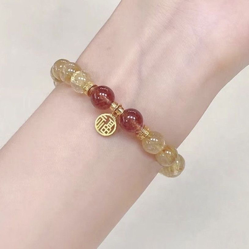 12629525.晶芭莎 福牌巴西天然金发晶草莓晶手链
