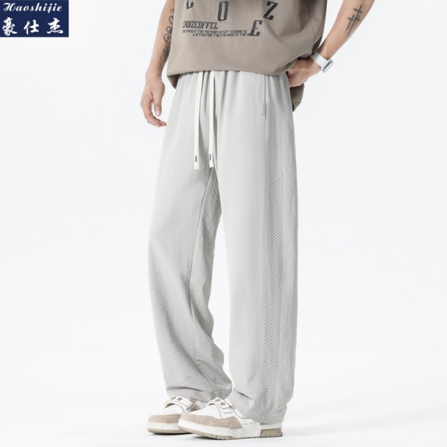 13537457.《休闲简约》夏季爆款个性透气孔时尚潮流简约男宽松休闲裤