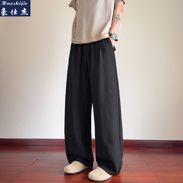 13631198.《百搭潮流》夏季新款老钱风舒适透气拼接仿麻弯刀裤男